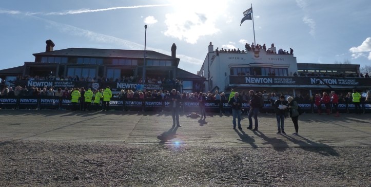 Putney Embankment. On the left is Thames, the temporary home of the media centre, and on the right is Imperial College, the temporary home of the Oxford women.