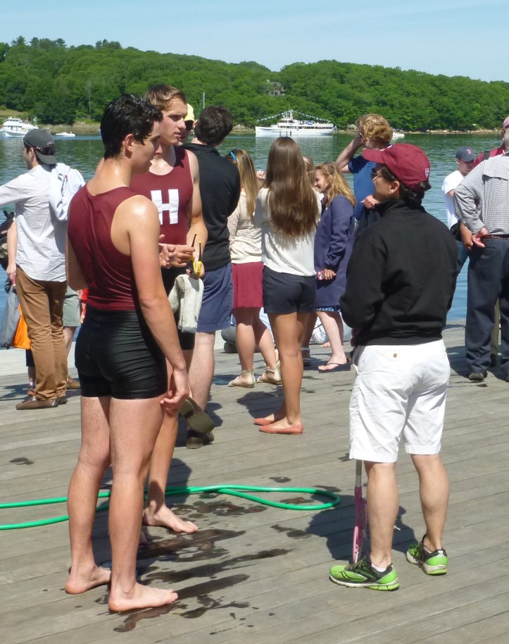 Two wet oarsmen, a sign of victory.