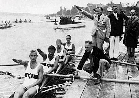 The German coxless four give the Nazi salute.