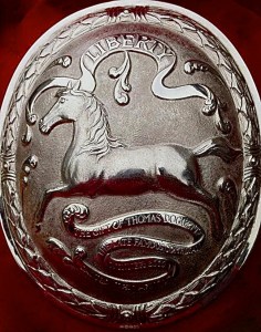 Pic 1. Part of the prize for winning the Doggett’s Coat and Badge sculling race, a silver arm badge. It shows the running white horse, the symbol of King George I’s House of Hanover, and the inscriptions ‘Liberty’ and ‘The gift of Thomas Doggett, the late famous comedian’ – plus the name of the winner of that particular badge. Doggett instigated the race in 1715 in celebration of George’s ascension to the throne and the securing of a Protestant line of succession.
