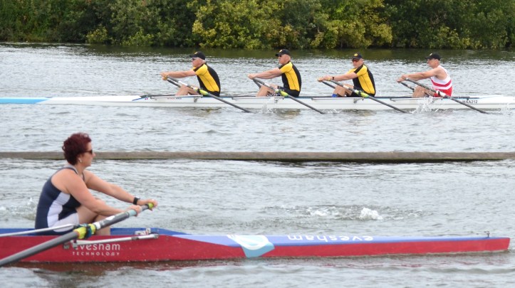 Pic 3. On their way to the start, the Malmoe/Kungalv composite from Sweden pass the Evesham crew racing in a semi-final of WC4+.