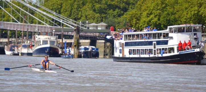 Pic 19. Pettipher pictured a few strokes away from the finish line (which is marked by the small blue rowing boat with the blue flags).
