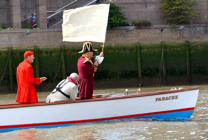 Pic 7. Umpire Robert Prentice starts the race just after 11.30 a.m.. Martin Spencer, the winner of Doggett’s in 1970, takes the timings. Robert and Martin won the Double Sculls together at Henley in 1976. On the radio is Major-General Colin Boag, Clerk to the Fishmongers’ Company (the ‘Clerk’ is actually the chief executive officer and not a Dickensian book keeper).