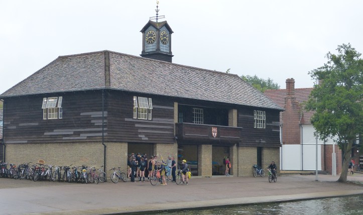 Pic 14. The Jesus College boathouse, built in 1932 to replace a Victorian structure that had been destroyed by fire. It boasts both a weather vane (meaning that a college has gone Head of the River for five consecutive years) and a clocktower (meaning that it has had ten years consecutive Headships). Some interpret this unwritten rule as meaning going ‘Head’ ten consecutive times, not years, that is five Lent Headships and five May Headships.