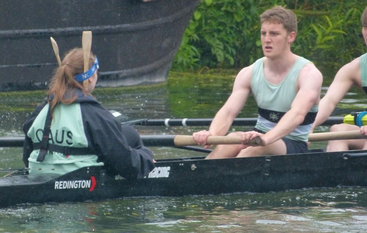 Pic 23. Caius III, who fell six places in Men’s Division IV, were ‘over bumped’ on day one and were then bumped every day after that – hence the spectacular drop. When wooden spoons have been presented, sometimes painted in college colours, it has usually been done at the boat club dinner. Perhaps this display by the cox on the water is a ‘new tradition’? If I were a pedant, I would point out that one of the ‘spoons’ that she is sporting is in fact a spatula.