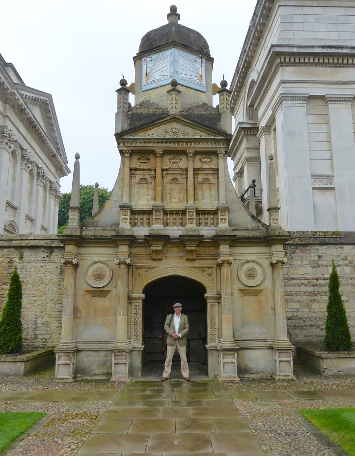 Pic 4. Tim at the ‘Gate of Honour’ in Caius Court, built c.1565. The college’s three gates symbolise the path of academic life. The student arrives at the Gate of Humility, in the centre of the college, they regularly passes through the Gate of Virtue and finally, the graduands pass through the Gate of Honour on their way to the Senate House to receive their degrees. Only Fellows https://en.wikipedia.org/wiki/Fellow of the college can routinely use the Honour gate – or walk on the grass in the quad.
