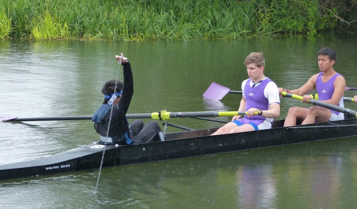 Pic 6. Until the race starts, the cox must show that he is still holding the bung.