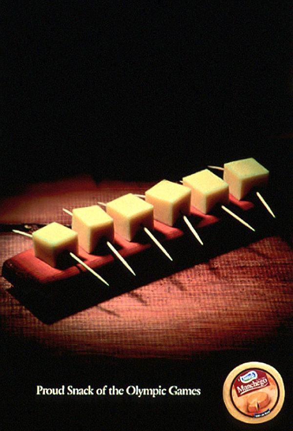 Pic 13. This advertisement from the 1984 Los Angles Olympics was a nice idea, but not properly thought out. I do not think that I am being pedantic when I say that there should have been (say) four squares of cheese – which would have thus represented a quadruple scull. Six squares do not mean anything – or am I missing something?