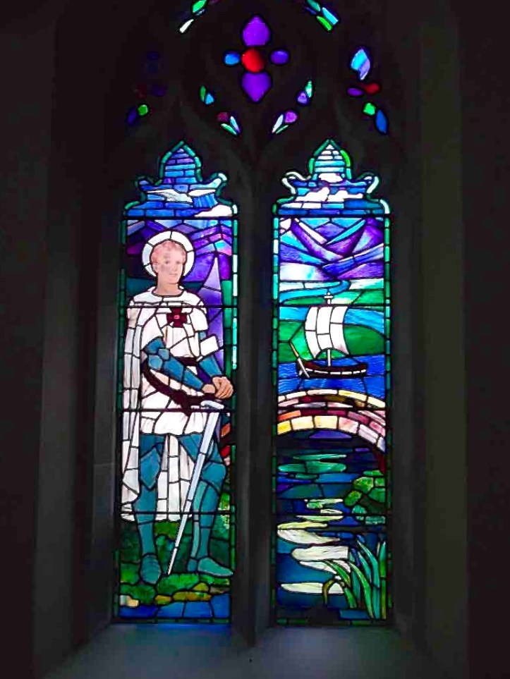 Pic 10. In 1923, Julian Gribble’s sister, Vivien, designed this stained glass window in St. Martin’s Church, Preston, Hertfordshire, depicting her brother’s face on a representation of St Martin. The Saint has what appears to be a Victoria Cross on his chest.