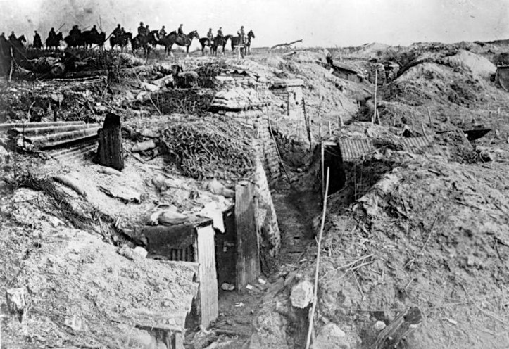 Pic 8. German troops pass an overrun British position during the initially successful phase of their 1918 Spring Offensive, largely an attempt to capture the Channel Ports before the Americans could effectively enter the war. 3455/18