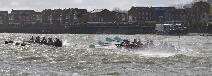 Pic 12. + 11 min 28 sec: By this stage it was clear that Cambridge had taken on a lot of water and that Oxford had better adapted to the extreme conditions. The times to Chiswick Steps were Oxford 12 min 39 sec, Cambridge 12 min 47 sec. Psalm 69:14. Deliver me from the mire and do not let me sink; May I be delivered from my foes and from the deep waters.