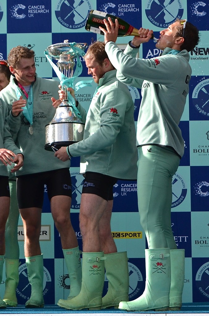 Pic 21. Luke Juckett holds the Boat Race Trophy in his hands, 2016.