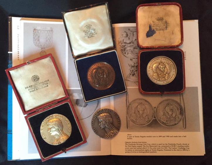 My four queens – a Bachelor’s Dream – including rowing gold and silver from the 1932 Tailteann Games. The Trinity Regatta winner’s medals are a 1912 in silver and a bronzed copper circa 1942. The background shows a pair of Trinity Regatta medals won in 1899 and 1900 and made into a belt buckle. The inscription on this pair reads: COLL SS ET INDIVID TRIN REG ELIZABETHÆ JUXTA DVBL 1591. Background Photo: In Black & White (1991) by Raymond Blake.