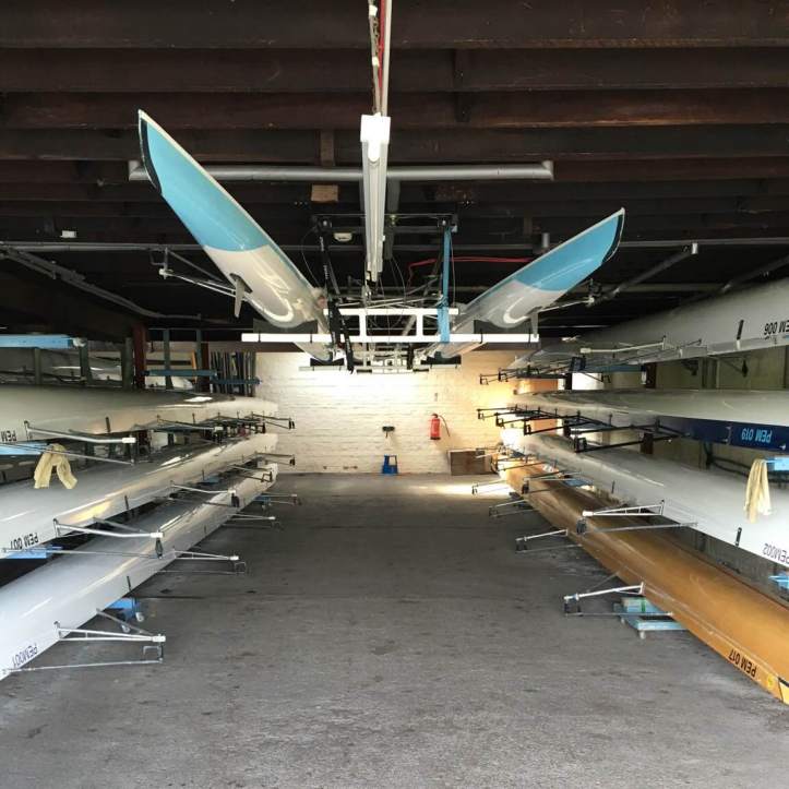 Picture 8: Our larger boat bay. In general women’s boats are stored on the right and men’s boats on the left, but this arrangement tends to shuffle around depending on the height of crews, what boats need repairing and who’s on the water at the same time. Photo: CL, with an iPhone 6 and VSCO.