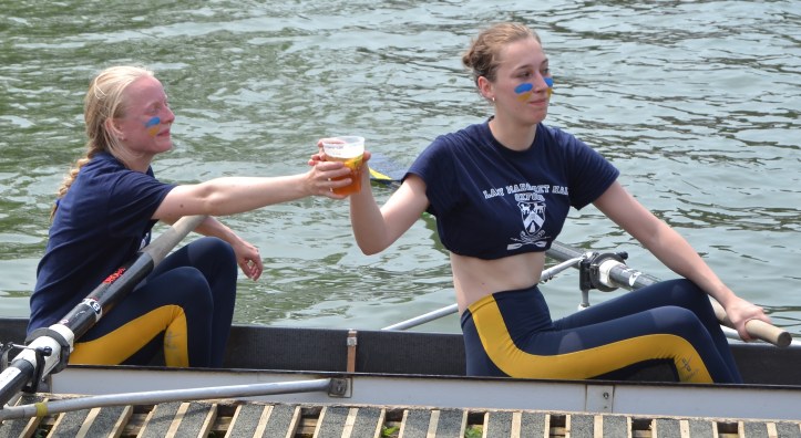 In Women’s Division V, Lady Margaret Hall (LMH) II celebrate something, possibly avoiding ‘spoons’ i.e. getting bumped every day. LMH’s Men’s Second Eight and Women’s First Eight both got ‘blades’ (illuminated oars) for bumping every day and both bumped up a rare five places into the division above.