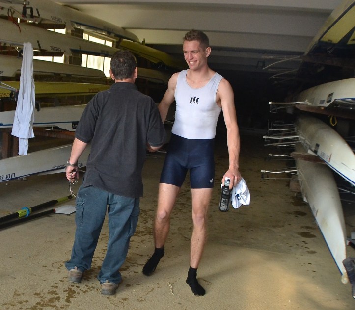 Oriel ‘4’ man, Alex Trigger is congratulated by the boatman.
