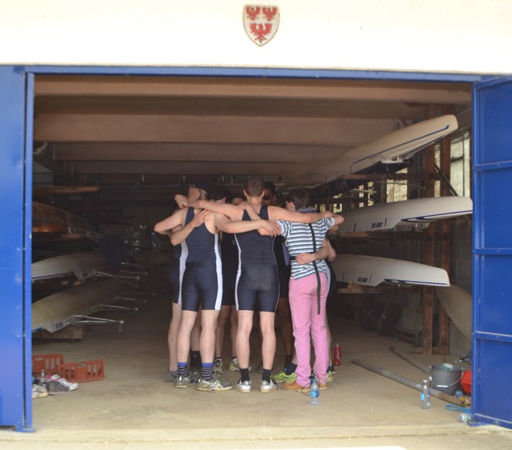 Pic 18. The boys from Queen’s II have a group hug before tackling Men’s Division V.
