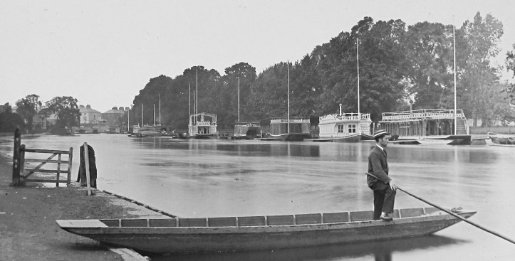 A picture from late Victorian times, showing the same scene as above. As I explained in my 2013 piece on the boathouses of Oxford, https://heartheboatsing.com/2013/04/22/oxford-beer-boathouses-and-barges/ from the 1840s the then unwanted ceremonial barges belonging to London Livery Companies were converted to floating clubhouses for Oxford boat clubs. They were splendid vessels for social occasions but squalid and impractical to row out of. In 1936, Christ Church was the first college to replace their barge with a land based boathouse and St Catherine’s was the last in 1978.