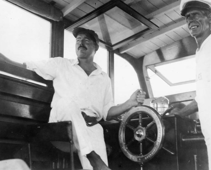 EH 8300P Ernest Hemingway and Carlos Gutierrez aboard Hemingway's boat, the Pilar, 1934. Photograph in the Ernest Hemingway Photograph Collection, John F. Kennedy Presidential Library and Museum, Boston.