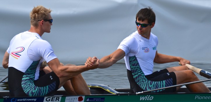 Pictured are Kluge (bow) and Ernsting (stroke) of Celler Ruderverein e.V. and Berliner Ruderclub, Germany, who lost to Braas and Steenman of Hollandia Roeiclub, Holland. Verdict: Not Rowed Out.