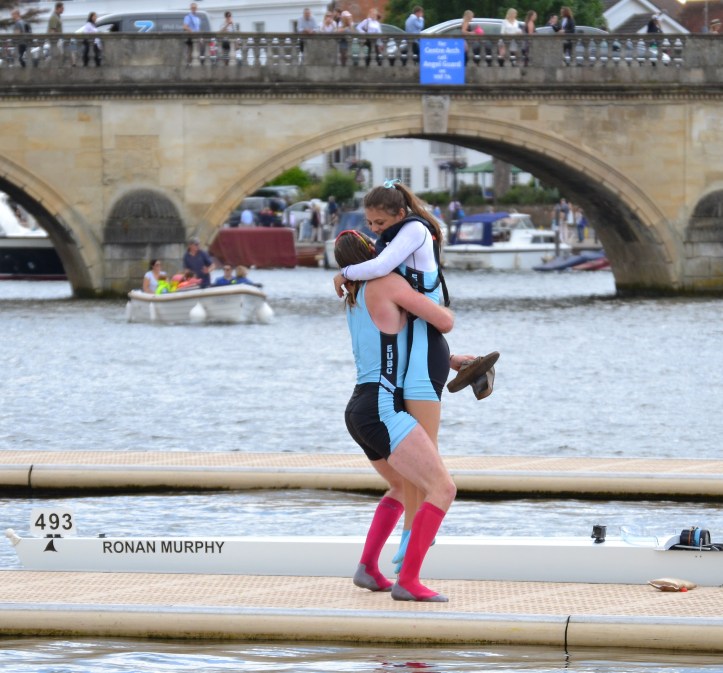 Two ways to treat a winning coxswain. Cox Mareolis gets squeezed and then tossed. You should see what they do to the losers.