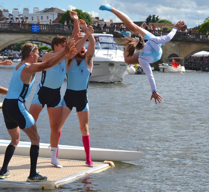 Two ways to treat a winning coxswain. Cox Mareolis gets squeezed and then tossed. You should see what they do to the losers.