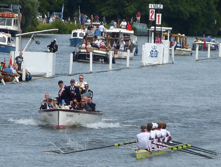 A interesting picture from earlier in the race. It does not prove anything but it is unusual for an umpire to take his eyes off the crews. Umpire Rankov seems to be looking at Dutch coach Diederik Simon (in the green baseball cap) who may be gesturing to his boat.
