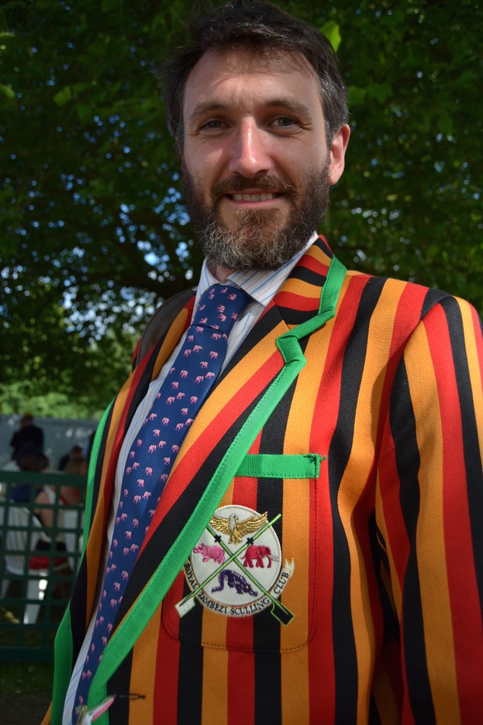 Photographer Hamish Roots. Some great examples of his work, rowing and otherwise, are on his website, lightoverwater.co.uk The site also tells the story behind his ‘Royal Zambezi Sculling Club’ blazer http://www.lightoverwater.co.uk/news/the-parmigiani-moon-row-2014/ and it shows some of Hamish’s wonderful pictures of sculling on the fourth-longest river in Africa.