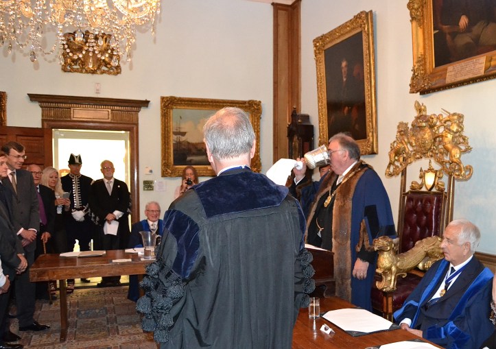 The Master shows the new Watermen how to drink beer.