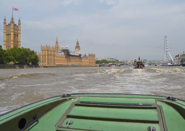 The Palace of Westminster, on the north bank of the Thames, is the meeting place of the House of Commons and the House of Lords, the two houses of the Parliament of the United Kingdom. Our interest is in the river steps and the tiny stone hut next to the trees on the left (in front of the grey temporary offices for those involved in the current restoration work).