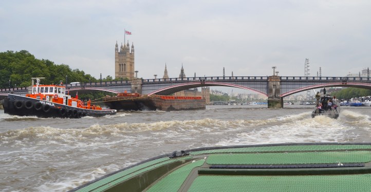 Approaching Lambeth Bridge, a reminder that the Thames is still a working river.