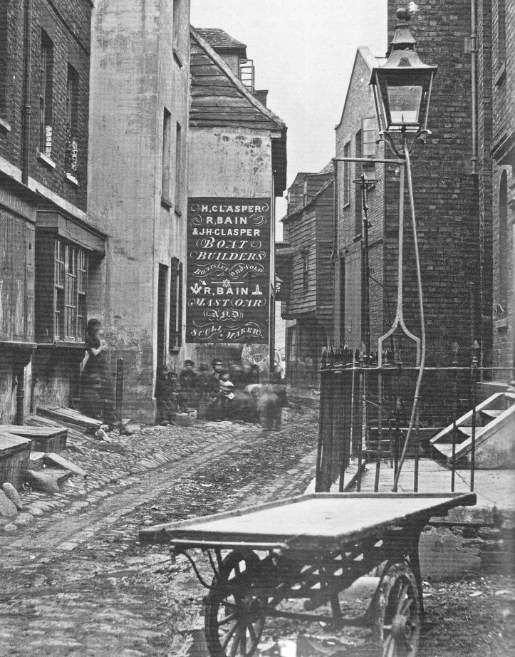 In another 1860s view of Upper Fore Street, the sign shows that ‘R Bain’ was also in the boat building business with two men having the magic name of ‘Clasper’. 