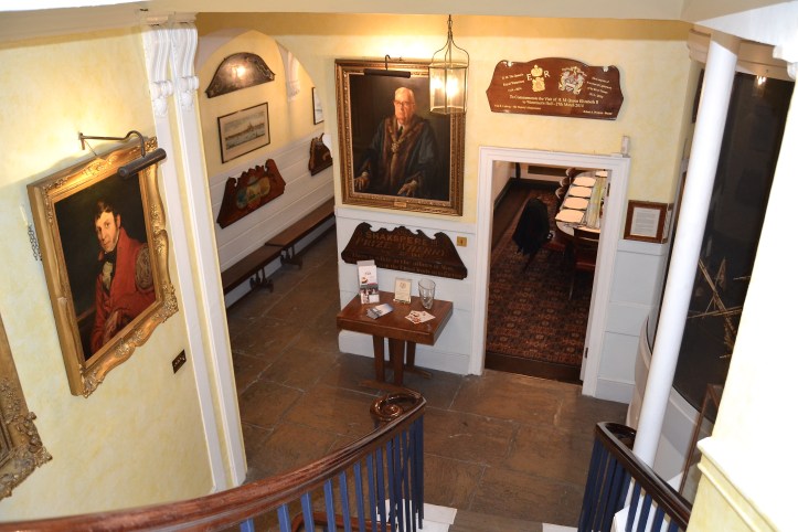 A view of the ground floor from the staircase of Waterman’s Hall. The entrance passage is to the left, the ‘Parlour’ (meeting room) is to the right.