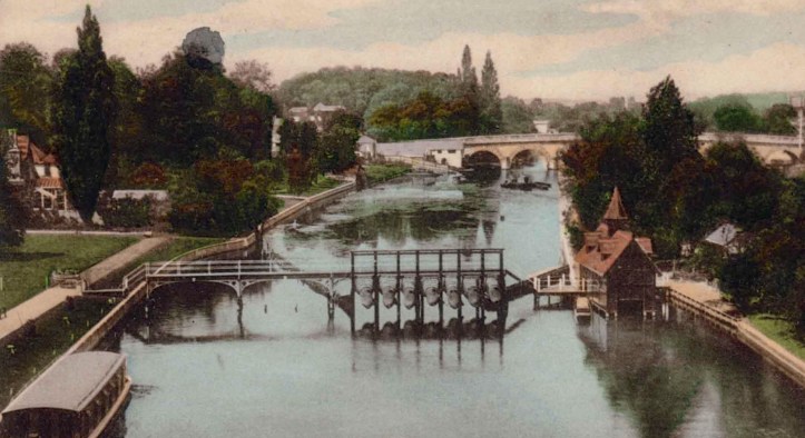 On the left is the club and grounds, on the right is the island and a boathouse with a little spire. The strange devices on the footbridge are eel traps.