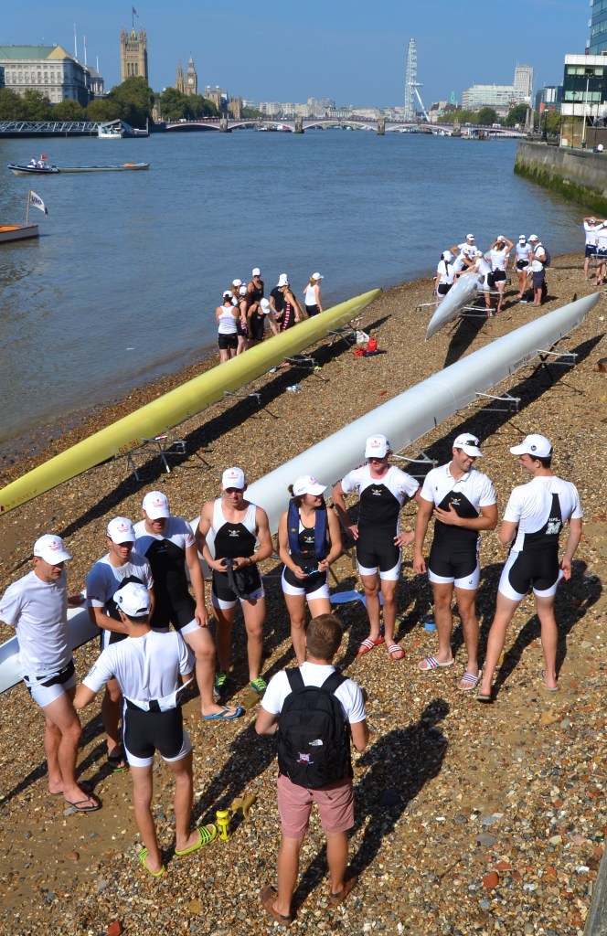 Eights on the foreshore with Lambeth Bridge and Parliament in the background.