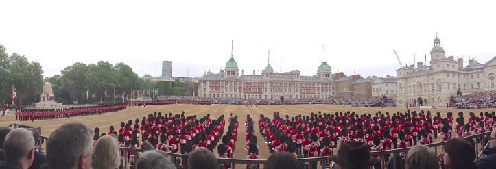 A panoramic view of the parade (click to enlarge). On the far left is the Guards Division War Memorial, https://en.wikipedia.org/wiki/Guards_Memorial in the centre are The Old Admiralty Buildings of 1726 http://britainexplorer.com/listing/old-admiralty-buildings/ and to the right is the Horse Guards building of 1753. For many years, the British Army was run from the latter and the Royal Navy from the former. 