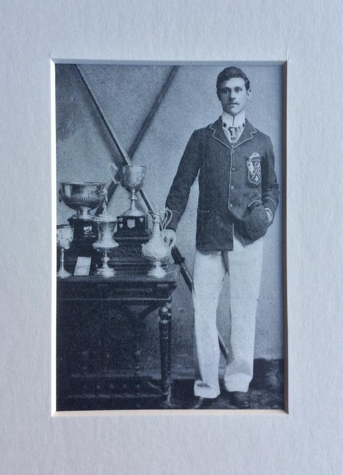 John Hall, Shannon Rowing Club, Limerick, the champion sculler of Ireland in 1901. The Eblana Challenge Cup with its original base with silver shields on which the names of previous winners were engraved. Hall was accomplished sculler and as a sweep rower formed a winning crew with Shannon R. C. club-mates, Healy, Shanahan and O’Brien. Together they stamped their dominance on senior rowing in Ireland over a number of years including a win in the other ‘championship event’ the Metropolitan Grand Challenge Cup. Photo: © Greg Denieffe.
