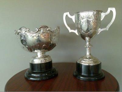 Two of the trophies belonging to Dublin Metropolitan Regatta: Schools’ Metropolitan Challenge Cup (JM4x) on the left and The Eblana Challenge Cup (M1x). The base of the Eblana is not the original. I bought a picture of the 1901 winner, see below, and in it the cup has a rectangular base. Photo: DMR.