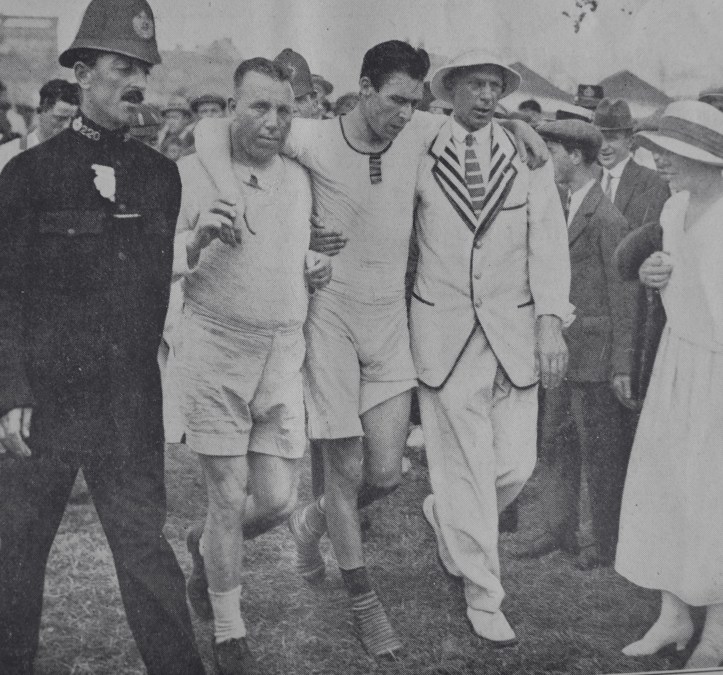 Pic 16. The latest winner of the Diamond Sculls, freshly plucked from the water, is supported on his left by Major EAE Howell of London Rowing Club and, on his right, by his trainer, Bossie Phelps.