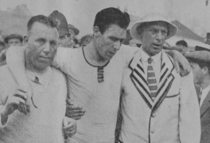 After winning the Diamonds and overturning his boat, back on land, Geoff is supported by trainer, Bossie Phelps (left) and by Major Howell (right).