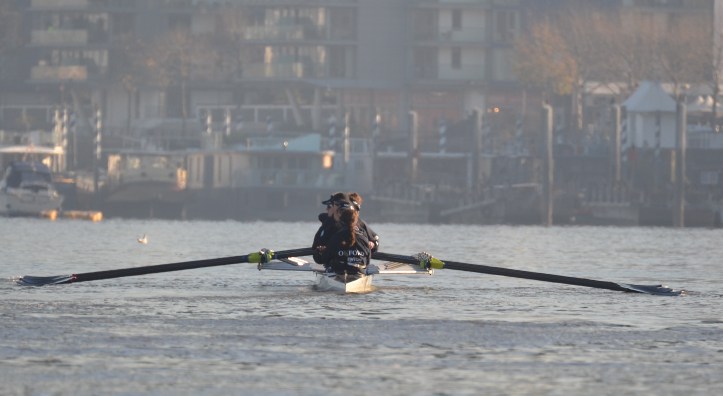 Waiting to be called to the start, the trial boat “Helen”, stroked by Jenna Hebert and coxed by Eleanor Shearer. The full crew lists are on the official website http://theboatraces.org/news-article/288/crews-announced-for-oxford-trial-eights as are the OUWBC biographies. http://theboatraces.org/ouwbc