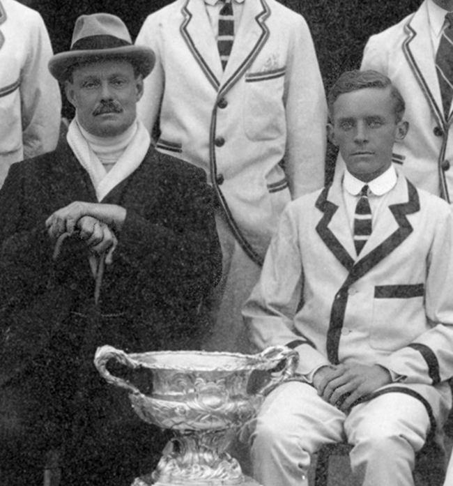 Steve Fairbairn (on the left) and Herbert L. Holman. The top of the Grand Challenge Cup trophy can be seen at the bottom of the image. Courtesy of Thames RC.